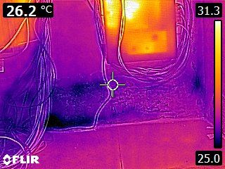 Infrared thermal image showing hidden moisture behind a wall